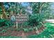 Entrance sign for Heron Pointe Private Resort Community surrounded by flowering plants at 223 Maisons Dr. # A8, Myrtle Beach, SC 29572