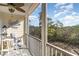 Relaxing screened balcony with seating, decor, and stunning nature views at 233 Banbury Ln. # 302, Little River, SC 29566