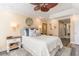 A large bedroom provides a calm retreat, with stylish appointments and mirrors at 233 Banbury Ln. # 302, Little River, SC 29566