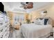 A large bedroom provides a calm retreat, with a ceiling fan and shuttered windows at 233 Banbury Ln. # 302, Little River, SC 29566