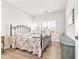 Bedroom with a metal frame bed, wood-style flooring, and a neutral color palette at 2609 Turchino Ct., Myrtle Beach, SC 29579