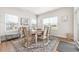 Dining room filled with natural light featuring an area rug and wainscoting details at 2609 Turchino Ct., Myrtle Beach, SC 29579