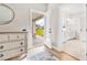 Hallway leading to bathroom with double sink vanity, toilet room, and the back patio through the glass door at 2609 Turchino Ct., Myrtle Beach, SC 29579