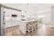 Bright and airy kitchen featuring white cabinets, stainless steel appliances, and an island with seating at 2609 Turchino Ct., Myrtle Beach, SC 29579