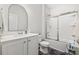 Bathroom featuring white vanity, framed mirror, toilet and glass shower at 2815 Eclipse Dr., Myrtle Beach, SC 29577