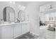 Bathroom featuring double vanity, framed mirrors and an open doorway to bedroom at 2815 Eclipse Dr., Myrtle Beach, SC 29577