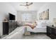 Bright bedroom featuring a ceiling fan, and a large dresser with a modern television on top at 2815 Eclipse Dr., Myrtle Beach, SC 29577