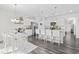 Inviting eat-in kitchen featuring a dining table, a central island with seating, and stainless-steel appliances at 2815 Eclipse Dr., Myrtle Beach, SC 29577