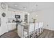 Well-lit kitchen featuring a central island with seating, modern appliances, and sleek, white cabinetry at 2815 Eclipse Dr., Myrtle Beach, SC 29577