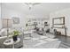 Open-concept living room with a cozy seating area, neutral tones, and a view into the kitchen and dining spaces at 2815 Eclipse Dr., Myrtle Beach, SC 29577