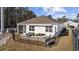 Back exterior featuring patio, screened porch, fenced yard, and landscaping at 2815 Eclipse Dr., Myrtle Beach, SC 29577