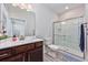 Well-lit bathroom featuring a vanity with sink, toilet, and walk-in shower with modern fixtures and neutral colors at 3105 White Jasmine Dr., Little River, SC 29566