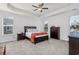 Spacious bedroom featuring a tray ceiling, lots of natural light, and stylish decor with plenty of space at 3105 White Jasmine Dr., Little River, SC 29566