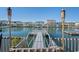 Waterfront backyard featuring a private dock and tiki torches creating an inviting outdoor space at 311 51St Ave. N, North Myrtle Beach, SC 29582