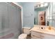 Comfortable bathroom with blue walls, shower, vanity, and sink at 311 51St Ave. N, North Myrtle Beach, SC 29582