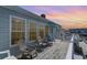 Outdoor deck of home featuring water views with patio furniture and serene sunset at 311 51St Ave. N, North Myrtle Beach, SC 29582