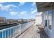 Enjoy the serene canal view from this charming deck with white railing and comfortable seating at 311 51St Ave. N, North Myrtle Beach, SC 29582