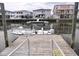 View of waterfront homes from the dock with a fishing boat moored nearby at 311 51St Ave. N, North Myrtle Beach, SC 29582