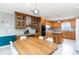 Traditional eat-in kitchen featuring wood cabinets, granite counters, kitchen island, and stainless steel appliances at 311 51St Ave. N, North Myrtle Beach, SC 29582