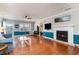 Bright living room featuring hardwood floors, a fireplace, and views to other living spaces at 311 51St Ave. N, North Myrtle Beach, SC 29582