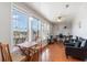 Bright living room featuring large windows, hardwood floors, and a functional work space at 311 51St Ave. N, North Myrtle Beach, SC 29582