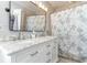 This bathroom has a dual sink vanity with a tiled shower and nautical-themed decor for relaxation at 354 Deer Run Ave., Georgetown, SC 29440