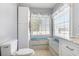 This bathroom features a tiled space with bench seating and a large window providing lots of light at 354 Deer Run Ave., Georgetown, SC 29440