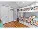 This room features bunk beds and a closet with wood flooring and a light color scheme for a restful space at 354 Deer Run Ave., Georgetown, SC 29440