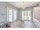 Cozy dining area with french doors and a chandelier at 354 Deer Run Ave., Georgetown, SC 29440