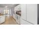 Clean, white kitchen with granite countertops and tile backsplash at 354 Deer Run Ave., Georgetown, SC 29440