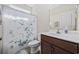 Neat bathroom featuring a vanity with sink, a mirror, toilet and shower with patterned curtain at 357 Cabo Loop, Myrtle Beach, SC 29588