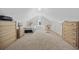 Attic bedroom featuring neutral walls and carpeting, a teddy bear, and a desk and chairs at 357 Cabo Loop, Myrtle Beach, SC 29588