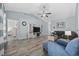 Cozy living room with a vaulted ceiling, entertainment center, blue accent wall, and comfortable seating at 357 Cabo Loop, Myrtle Beach, SC 29588