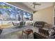 Covered patio featuring multiple seating areas, an outdoor dining table, and a ceiling fan at 357 Cabo Loop, Myrtle Beach, SC 29588