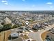 Aerial view of a neighborhood with a lake and lots of trees at 360 Cattle Drive Circle, Myrtle Beach, SC 29588