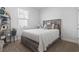 Bright bedroom featuring natural light and a rustic wood-styled bed frame at 360 Cattle Drive Circle, Myrtle Beach, SC 29588