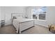 Well-lit bedroom featuring a large window and a wood-style bed frame at 360 Cattle Drive Circle, Myrtle Beach, SC 29588