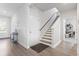 Hallway with staircase and wood-look flooring, creating a welcoming space at 360 Cattle Drive Circle, Myrtle Beach, SC 29588