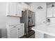 Bright kitchen with stainless steel refrigerator and white cabinets at 360 Cattle Drive Circle, Myrtle Beach, SC 29588