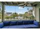 Relaxing balcony featuring a plush blue cushioned couch, a fan, and a view of the outdoors at 404 72Nd Ave. N # 203, Myrtle Beach, SC 29572