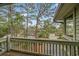 Balcony with a relaxing view of trees, greenery, and an adjacent house at 404 72Nd Ave. N # 203, Myrtle Beach, SC 29572