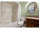 Bathroom with a combined shower-tub, ample lighting, and a wooden vanity for storage at 404 72Nd Ave. N # 203, Myrtle Beach, SC 29572