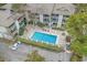 Aerial view of the pool with lounge chairs and a nearby parking lot at 404 72Nd Ave. N # 203, Myrtle Beach, SC 29572