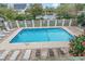 Relaxing community pool with lounge chairs, perfect for enjoying the sunny days at 404 72Nd Ave. N # 203, Myrtle Beach, SC 29572