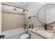 Bright bathroom features a shower over tub, granite topped vanity and modern fixtures at 405 Palo Verde Dr., Myrtle Beach, SC 29579