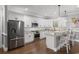 A gourmet kitchen featuring stainless appliances, granite countertops, and bright white cabinetry at 405 Palo Verde Dr., Myrtle Beach, SC 29579