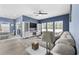 Open concept living room featuring a sectional sofa, built-in shelving, and view of the dining area at 4092 Bayhill St., Myrtle Beach, SC 29579