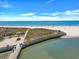 Expansive beach view with boardwalk, waterway, and the Atlantic Ocean, perfect for a relaxing coastal lifestyle at 415 Ocean Creek Dr. # 2359, Myrtle Beach, SC 29572