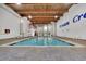 Large indoor pool with a wood ceiling, perfect for year-round enjoyment and recreation at 415 Ocean Creek Dr. # 2359, Myrtle Beach, SC 29572