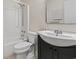 Classic bathroom featuring a single sink vanity, toilet, and shower-tub combination with white tile at 4150 Horseshoe Rd. # 33, Little River, SC 29566